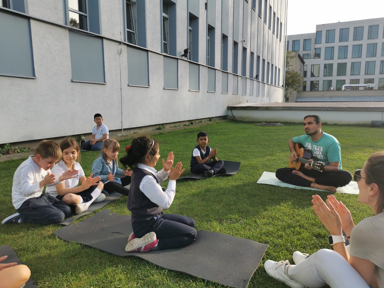 Children taking part in music and yoga learning in Kraków